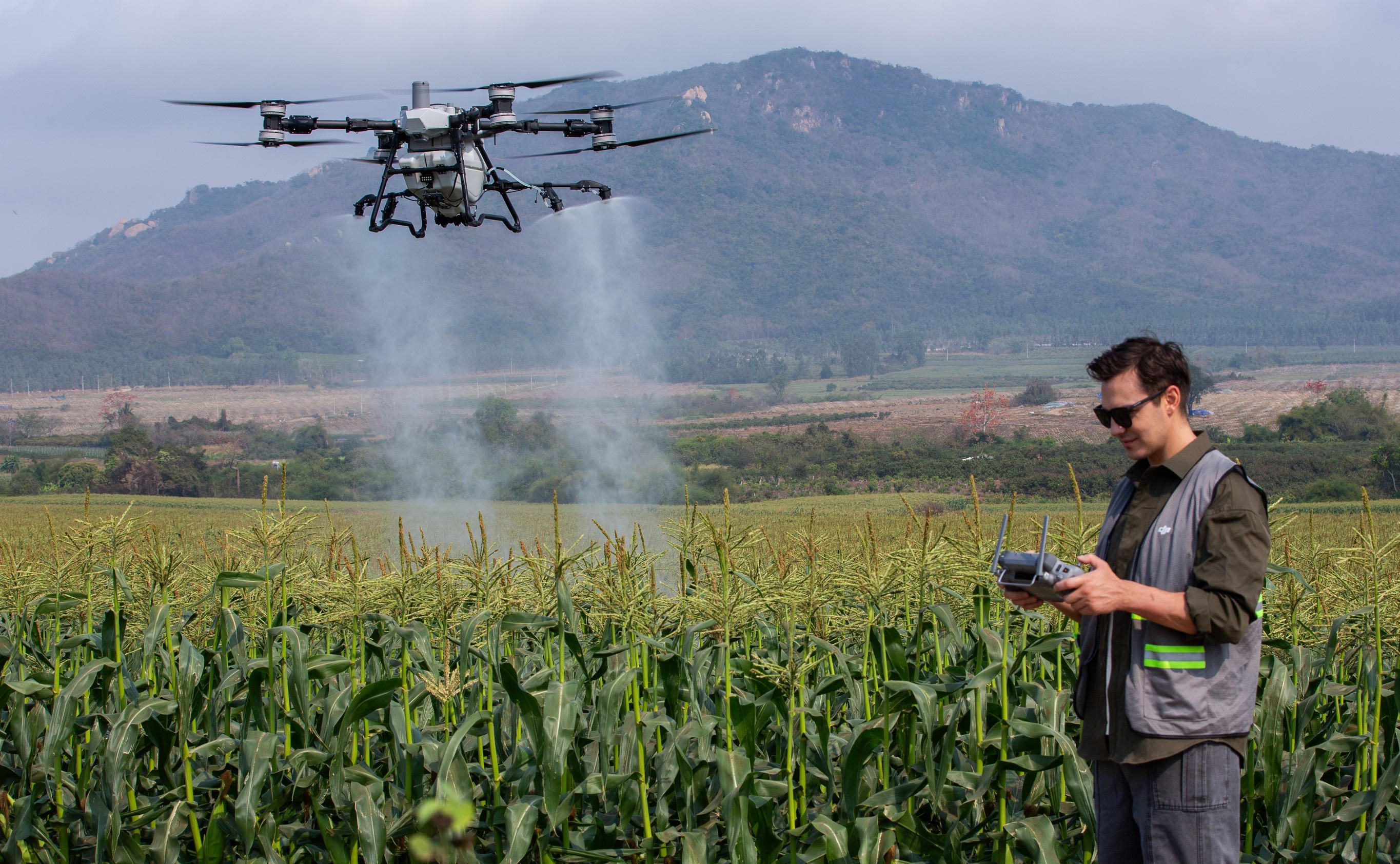 dji-agras-t100-100-liter-crop-sprayer-in-field.jpg